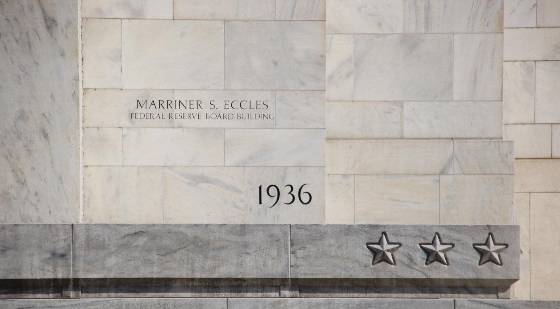 Engraved cornerstone of the Marriner S. Eccles Federal Reserve Board Building with decorative stars