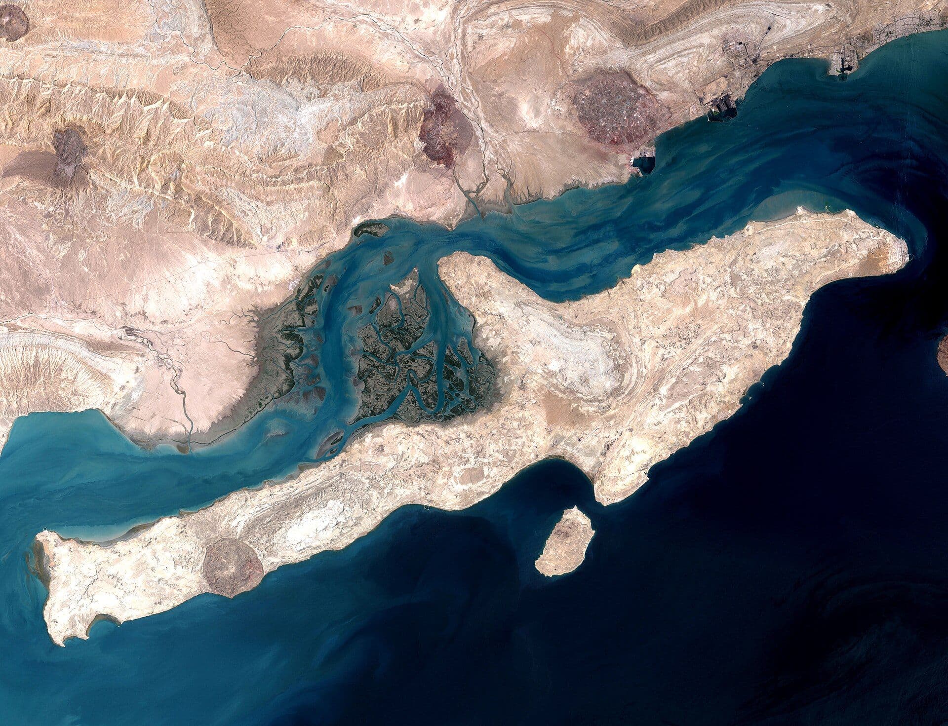 Satellite view of Qeshm Island and the Strait of Hormuz showing waterway winding between desert terrain
