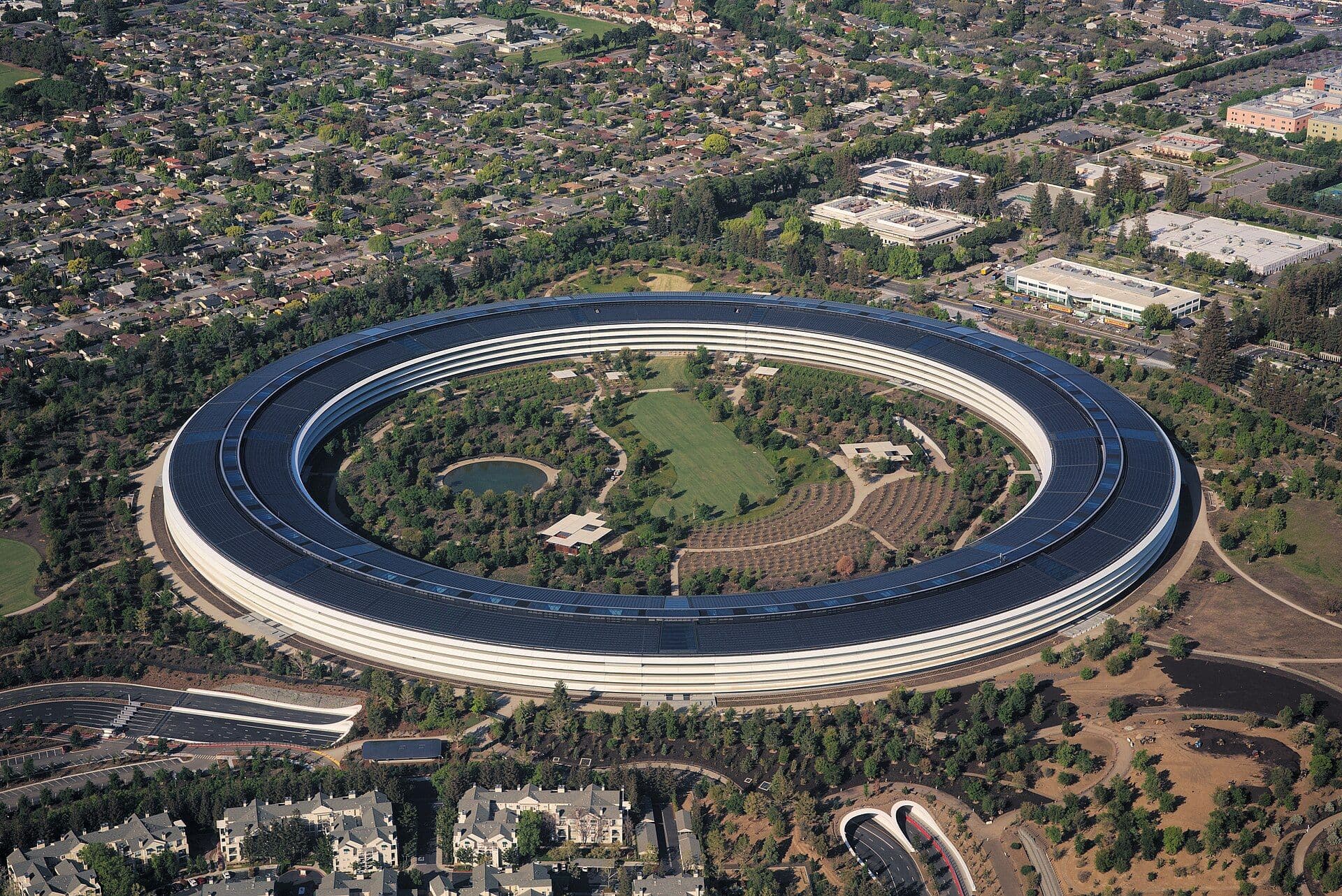 Aerial view of Apple Park's distinctive circular building with solar panel roof