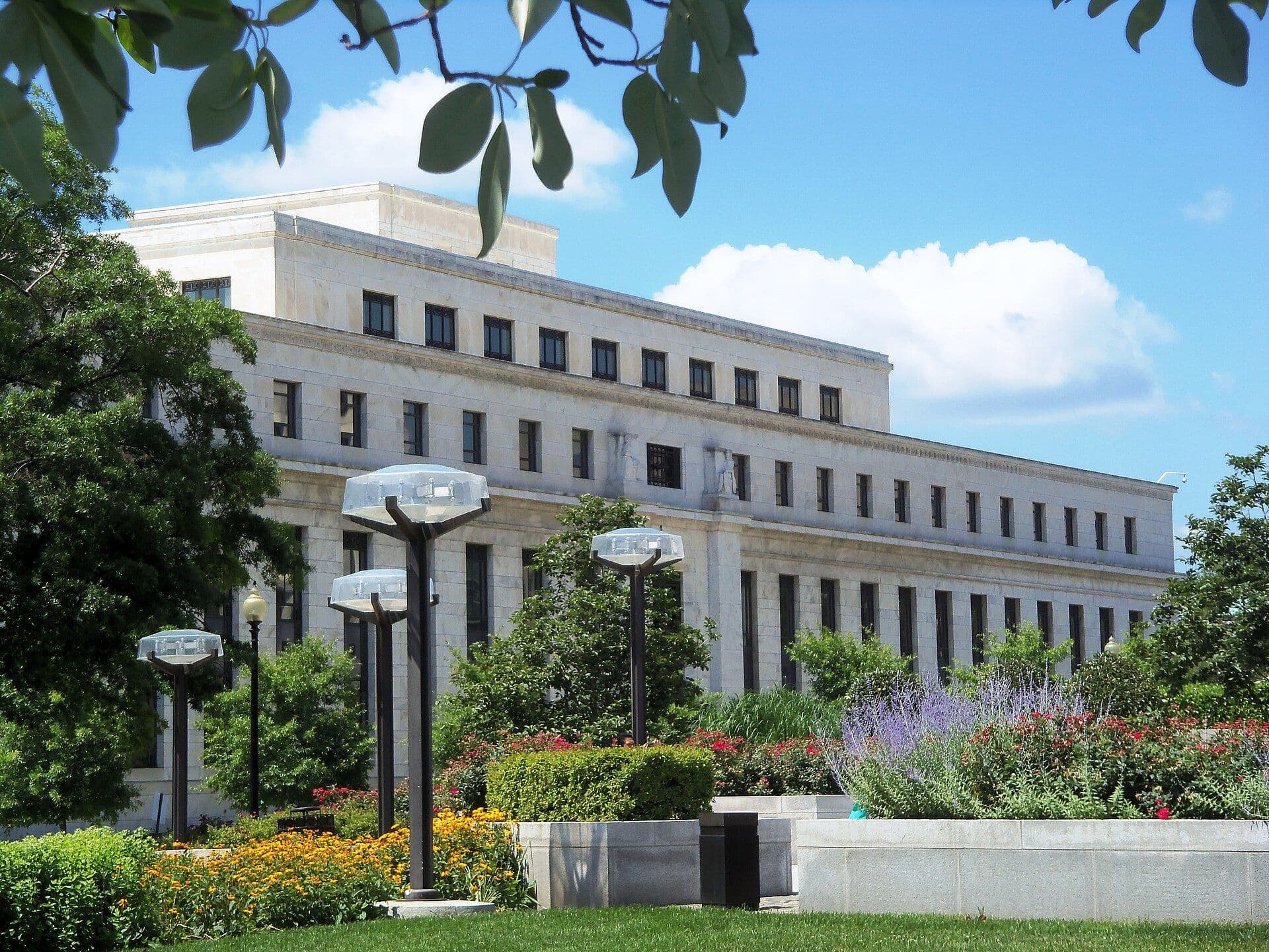 The Eccles Building of the Federal Reserve with landscaped gardens in the foreground, Washington, D.C.