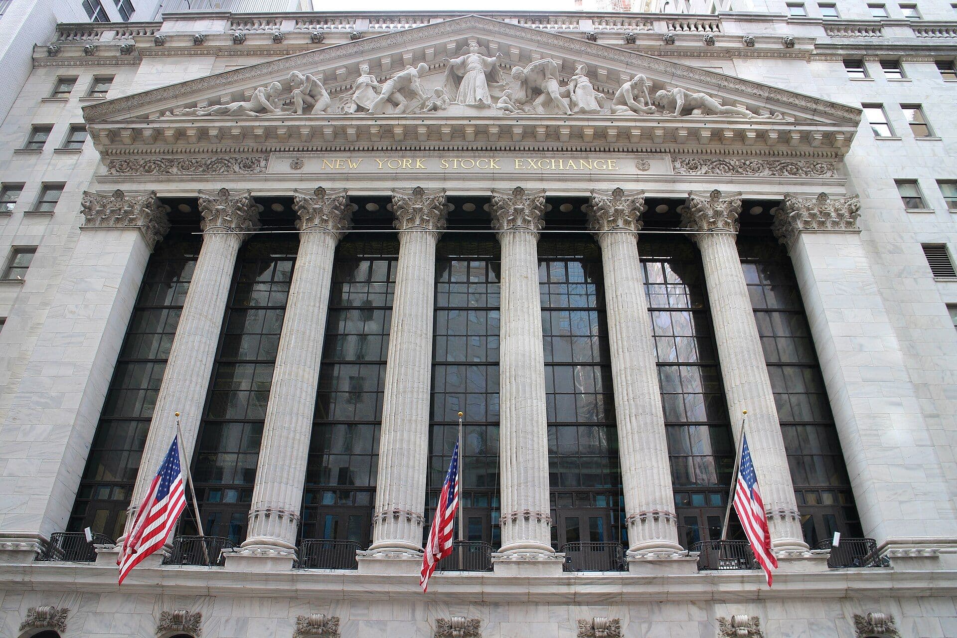 Classical facade of the New York Stock Exchange building with columns and sculptural relief